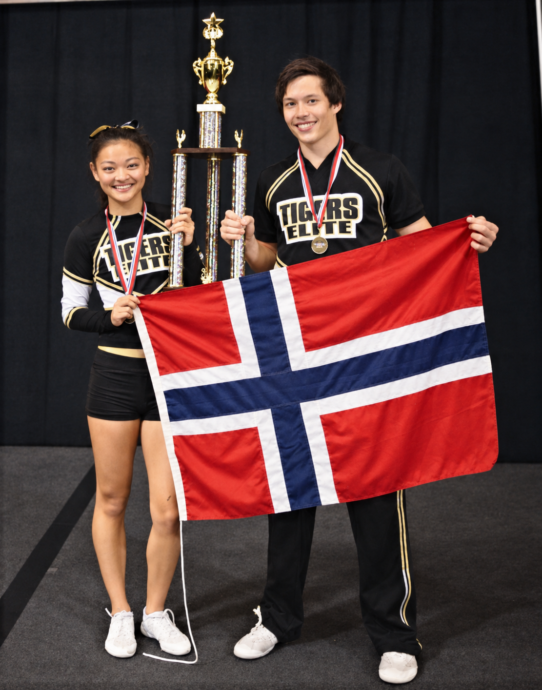 Didrik and his NRC Tigers Fear partner holding a trophy and the Norwegian flag